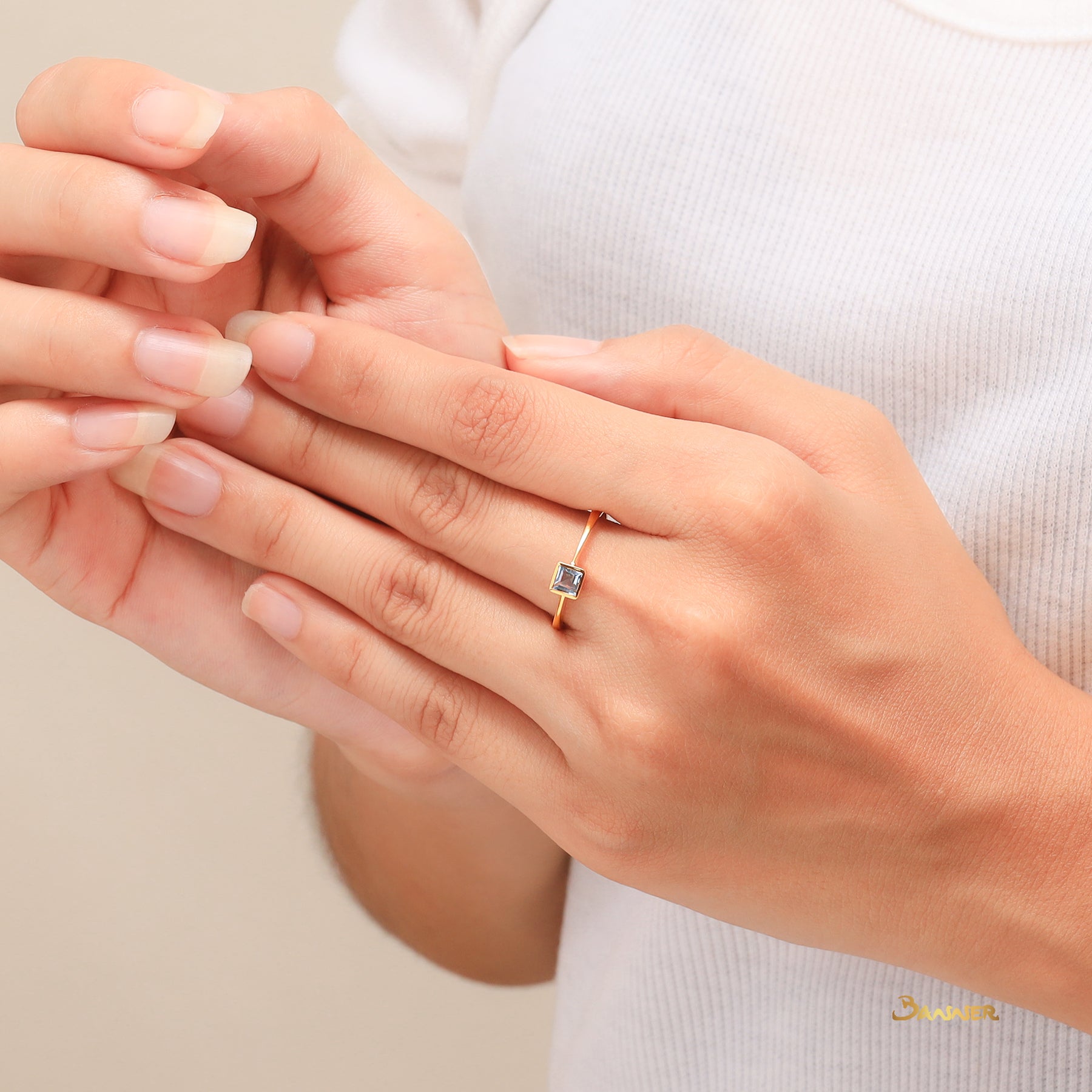 Emerald-cut Blue Topaz Solitaire Ring