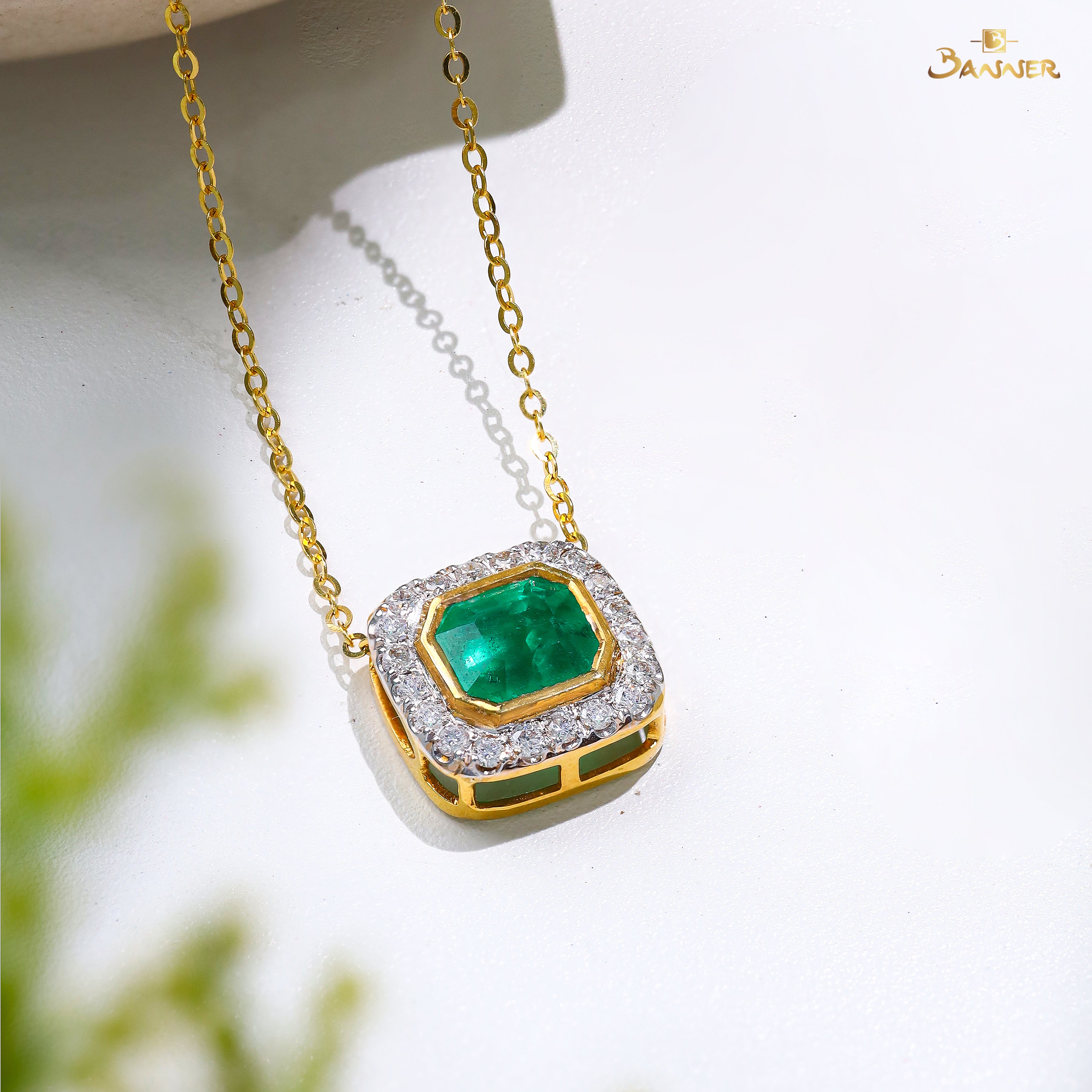 Columbia Emerald and Diamond Halo Pendant