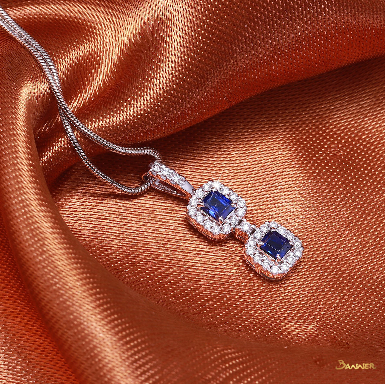 Emerald-cut Sapphire and Diamond 2-Step Halo Pendant
