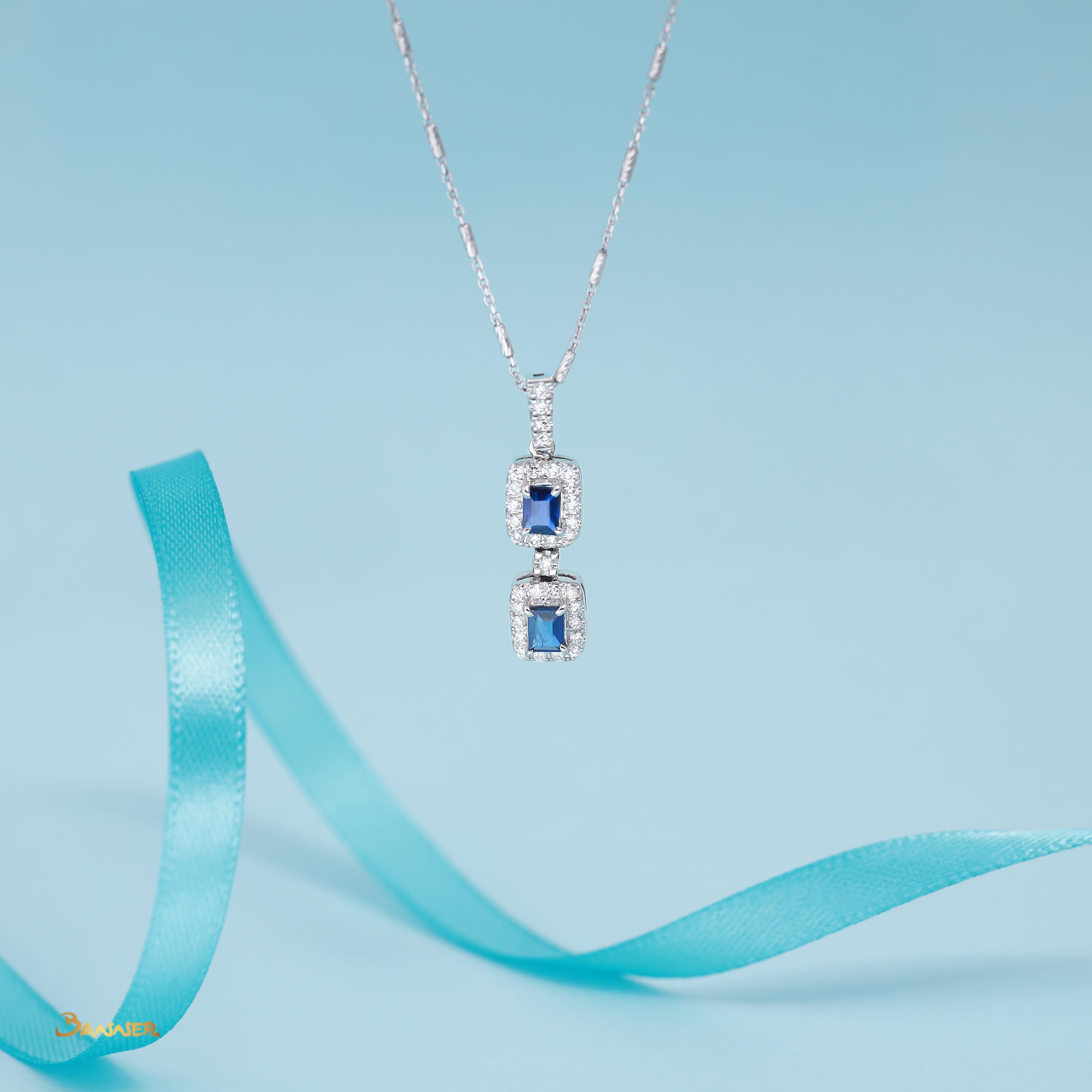 Emerald-cut Sapphire and Diamond 2-Step Halo Pendant