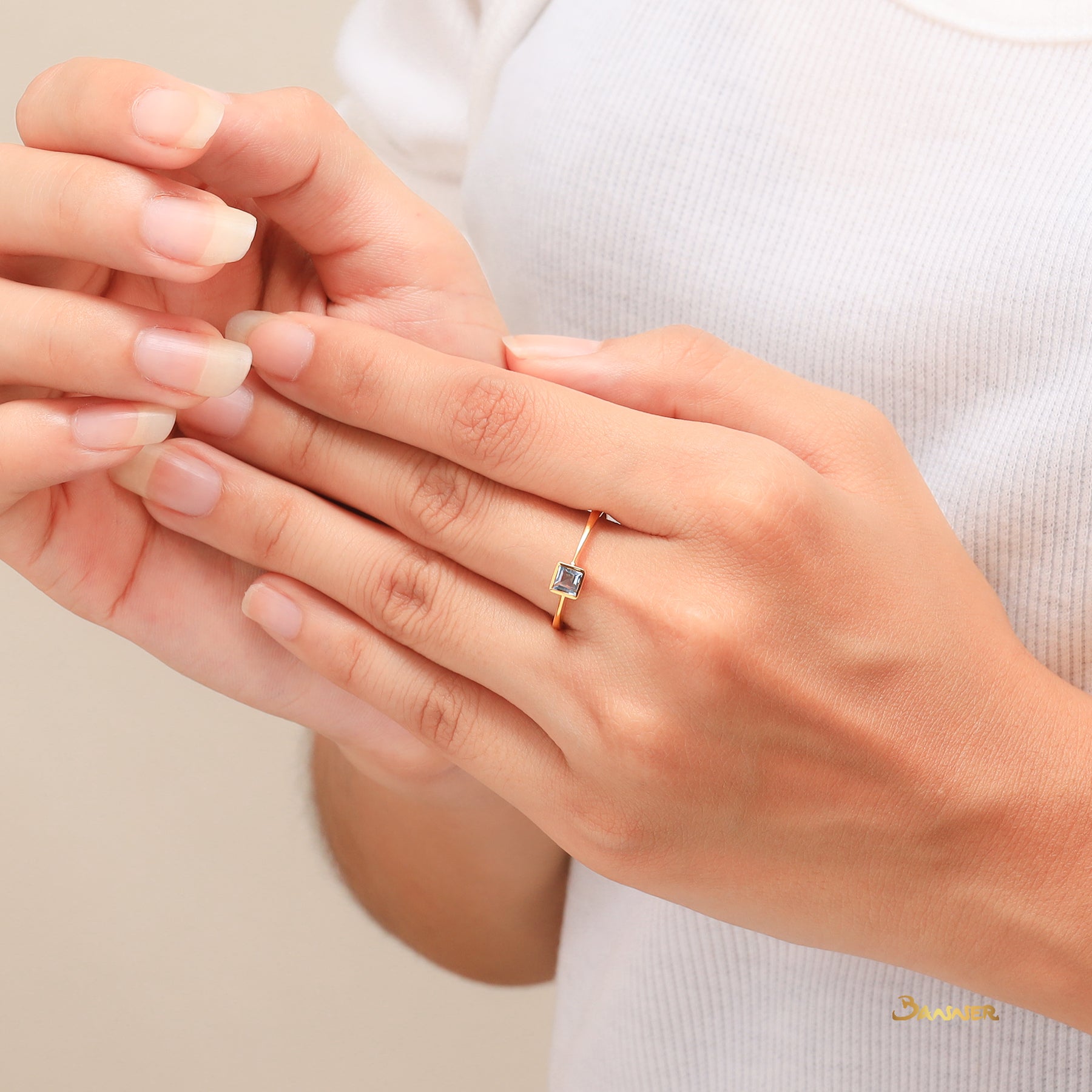 Emerald-cut Blue Topaz Solitaire Ring