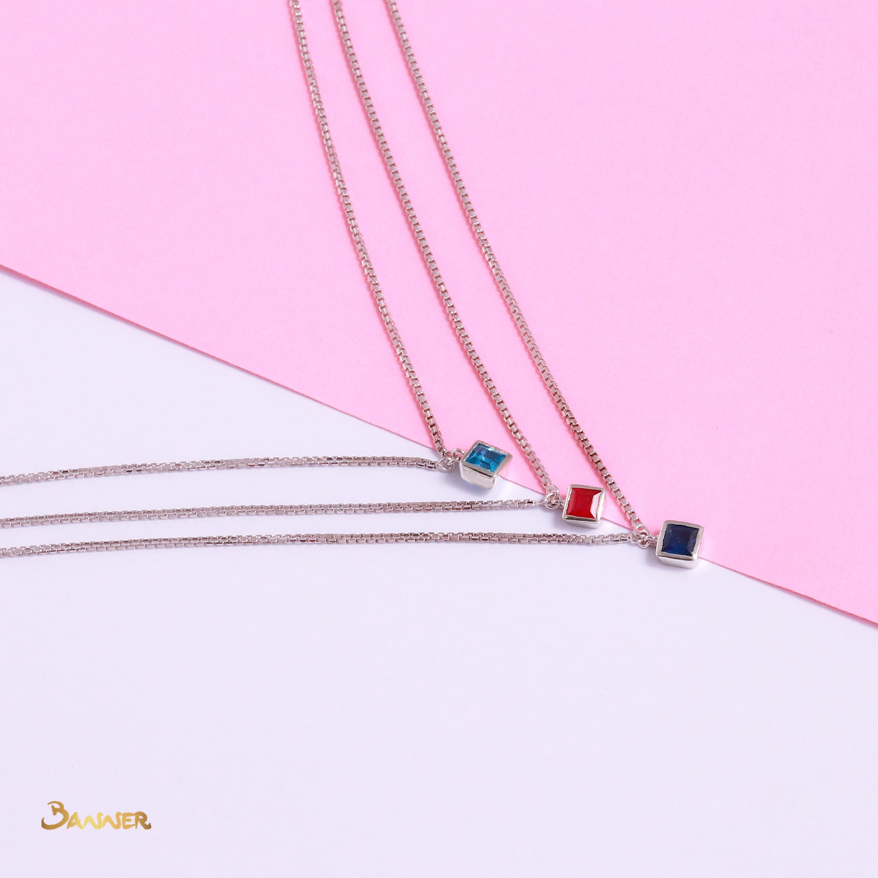 Emerald-cut Blue Topaz, Ruby and Sapphire Necklace