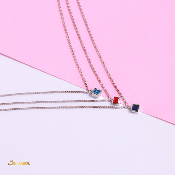 Emerald-cut Blue Topaz, Ruby and Sapphire Necklace