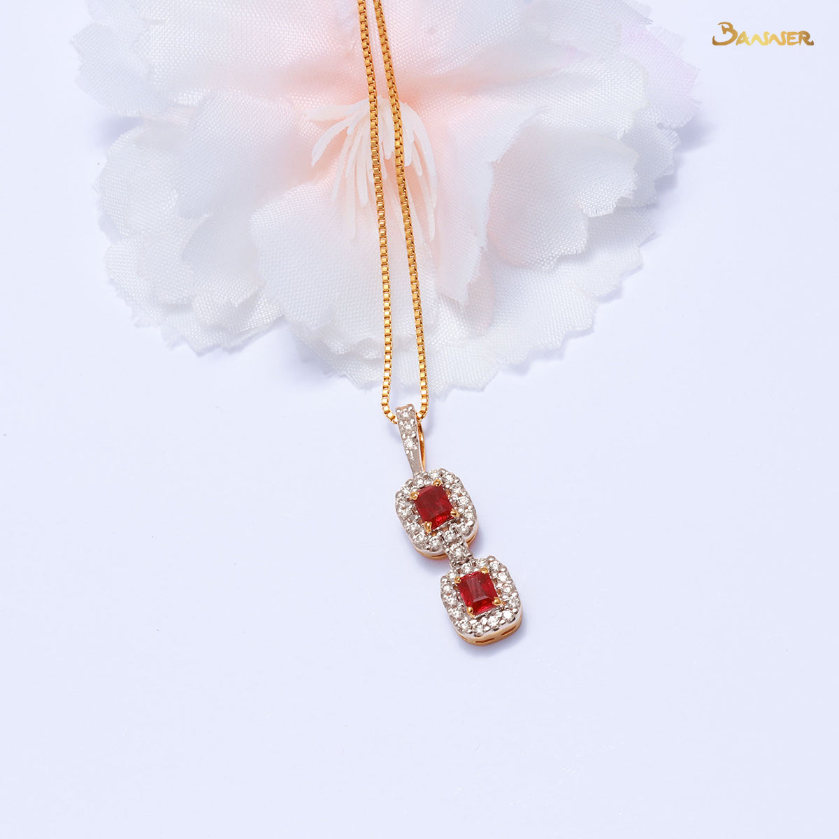 Emerald-cut Ruby and Diamond 2-Step Halo Pendant