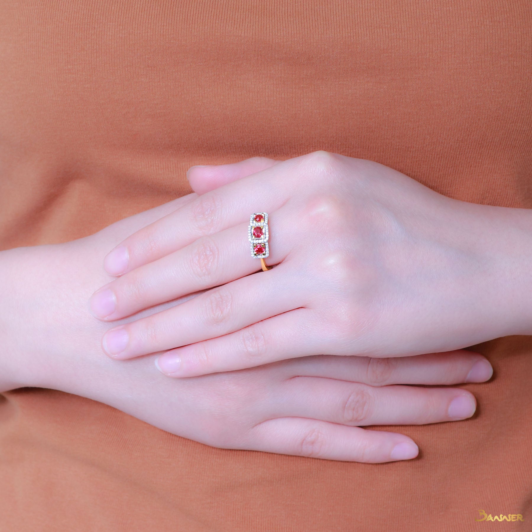 Ruby and Diamond Three-stone Halo Ring