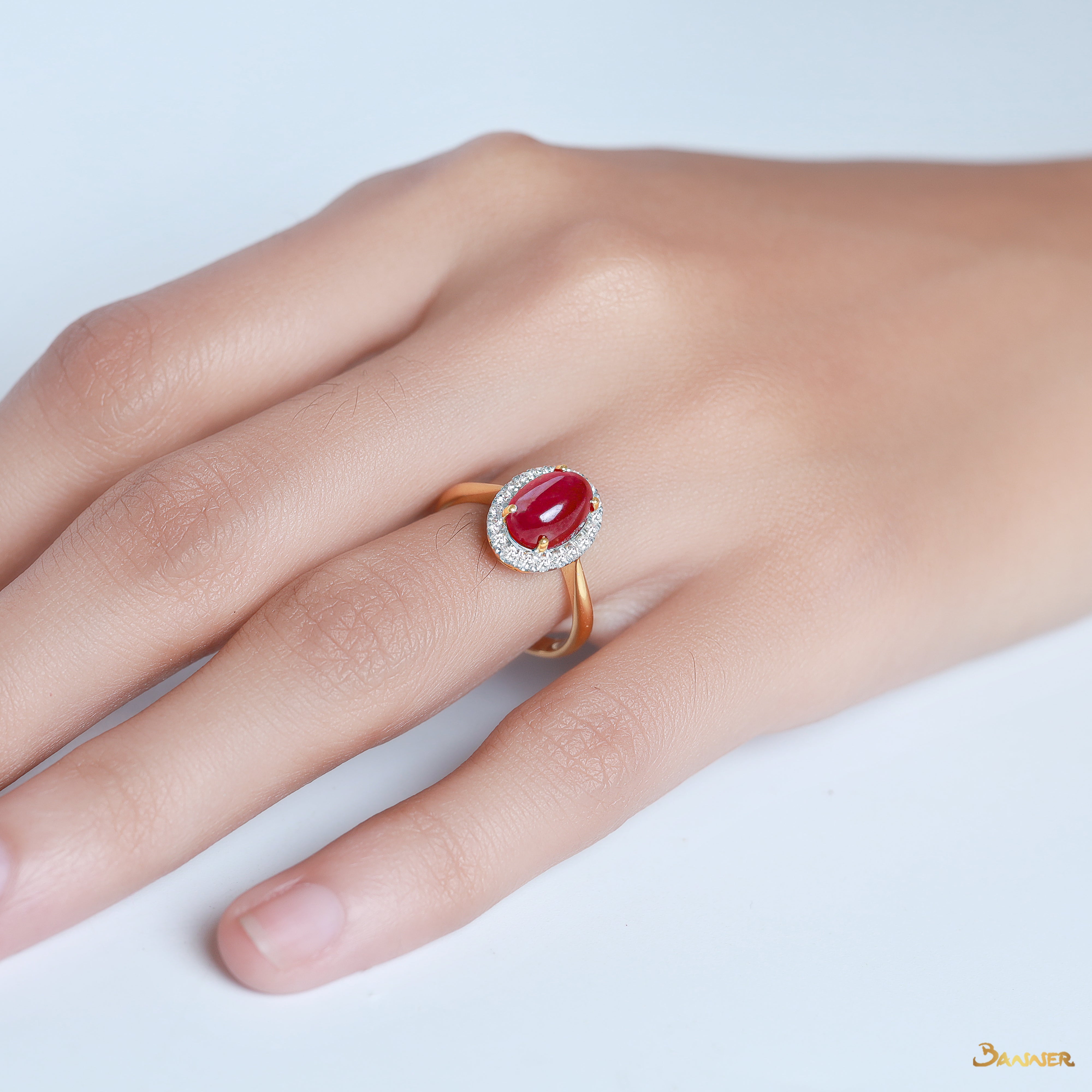 Ruby Cabochon and Diamond Halo Ring