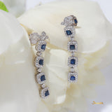 Emerald-cut Sapphire and Diamond 4-Step Dangle Halo Earrings