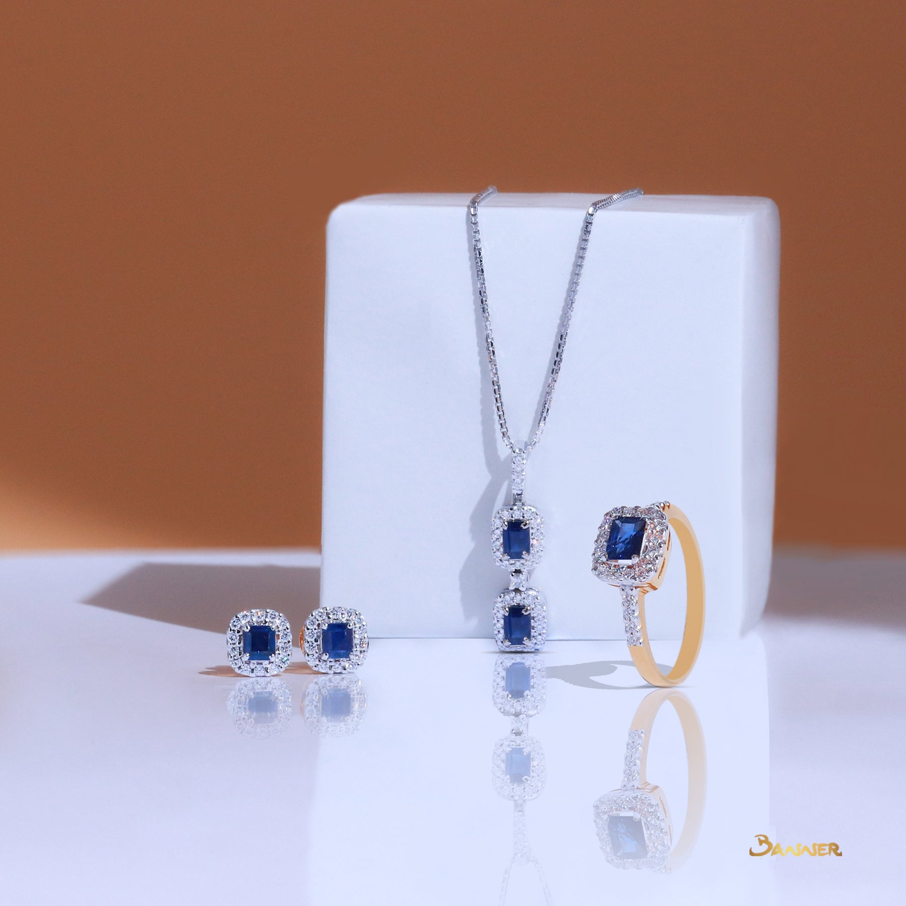 Emerald-cut Sapphire and Diamond Halo Set