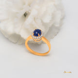 Sapphire Cabochon and Diamond Halo Ring
