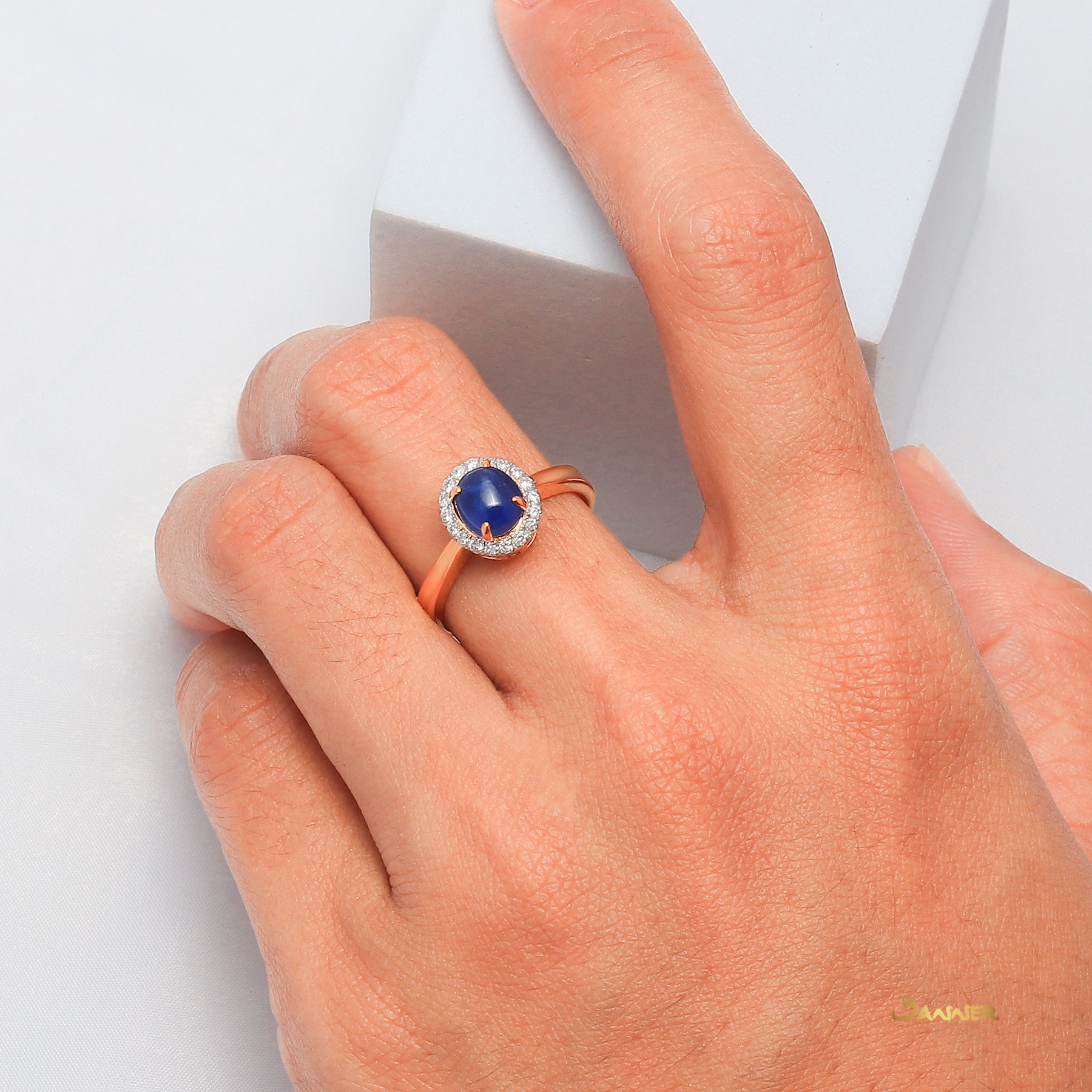 Sapphire Cabochon and Diamond Halo Ring