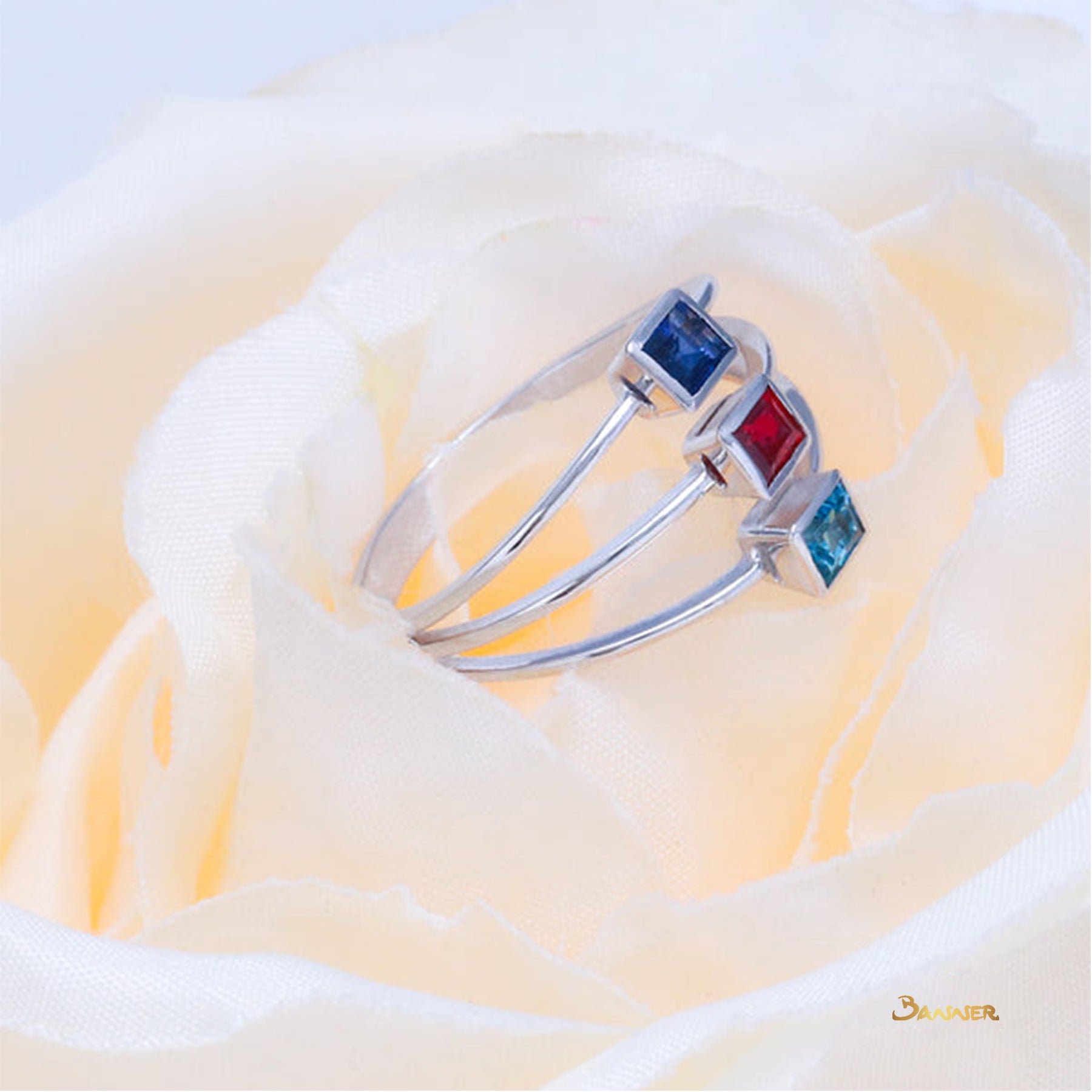 Emerald-cut Blue Topaz, Sapphire and Ruby Ring